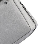 MarkRyden Classic I Tech Commuter Briefcase in gray fabric, featuring a zipper pocket and button detail, designed for 14/15.6 inch laptops.