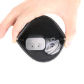 Markryden black anti-theft coin pouch held open, holding 20W charger and cable