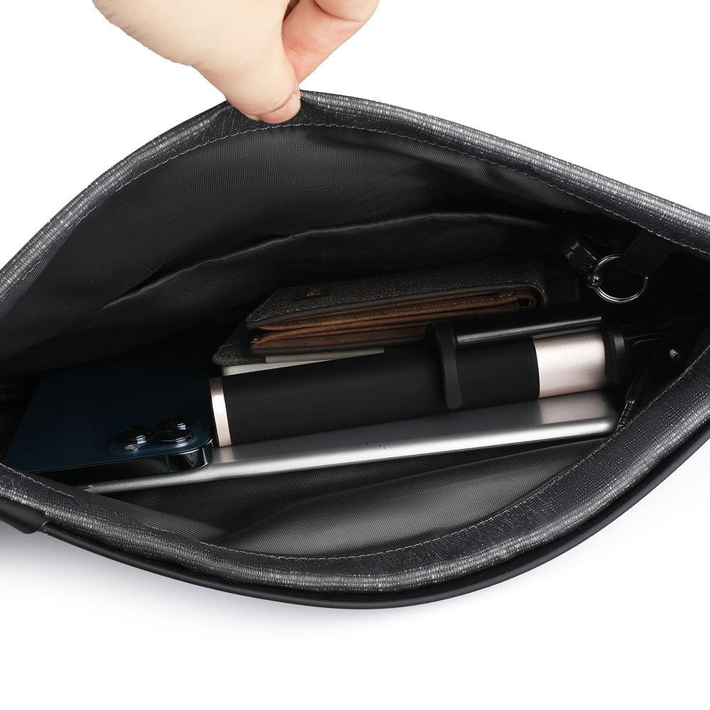 MarkRyden black chest bag interior with daily travel items, streamlined design