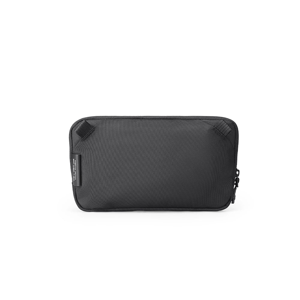 Black Switchstorage IV Convertible Toiletry Crossbody Bag with zippered pocket and compact rectangular shape, designed for modern travelers.