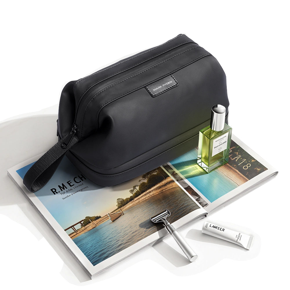 MarkRyden black toiletry bag with wet dry sections on travel magazines
