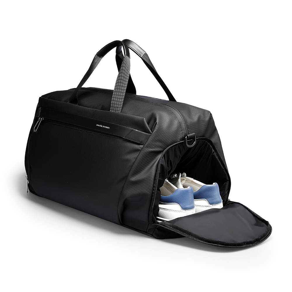 Deformable II black leather fitness sports handheld crossbody bag with open shoe compartment holding white and blue sneakers by MARKRYDEN