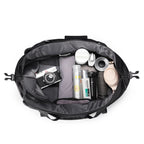 MarkRyden NomadFlex waterproof 3-in-1 gym bag holding camera & toiletries