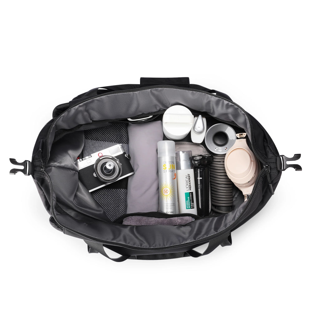 MarkRyden NomadFlex waterproof 3-in-1 gym bag holding camera & toiletries
