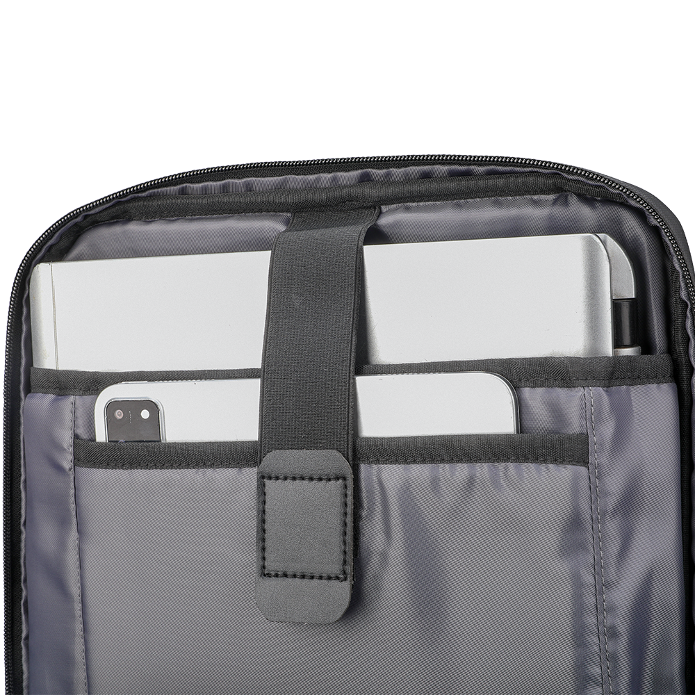ChargeFlex smart backpack interior with gray fabric, zippered compartment holding silver laptop, tablet, and smartphone, organized tech storage for daily use.
