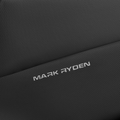 Close-up of dark gray textured leather on Mark Ryden Voyager Messenger Bag, showing embossed brand logo.