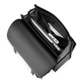 Black MUKE III Oxford backpack with open main compartment storing a laptop and other devices, ideal for school and business work.