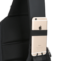 Mini Julius lightweight black crossbody bag with mesh back panel and secure phone holder, featuring USB charging for on-the-go convenience.