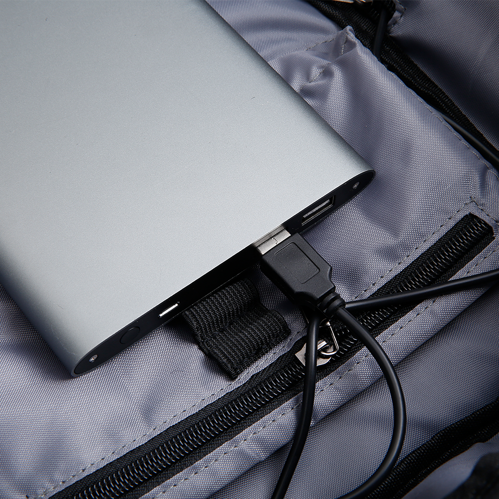 MARKRYDEN compacto laptop backpack with silver laptop and charging cable