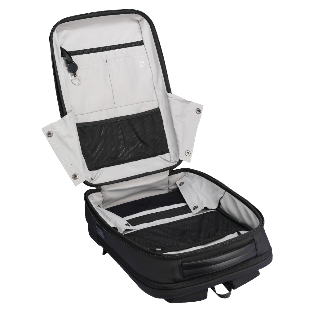 Black hard-shell work backpack with open interior showing light gray lining, mesh pocket, zippered compartments, and organized storage.