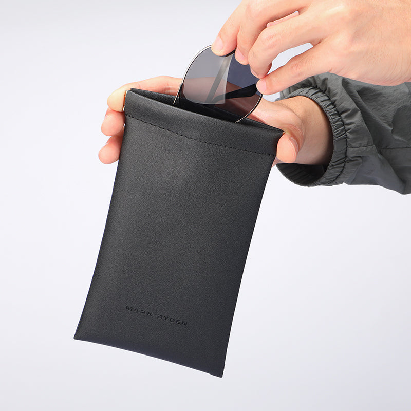 Mark Ryden black leather sunglasses pouch with person inserting sunglasses
