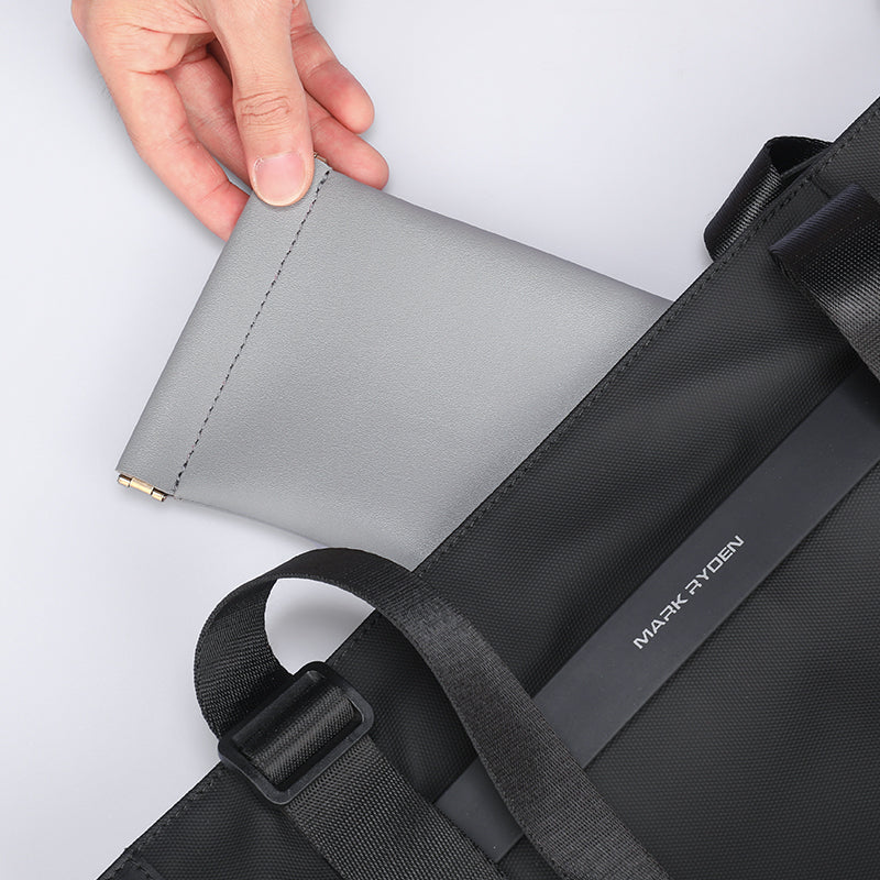 MarkRyden gray sunglasses pouch in black backpack
