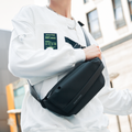 Mark Ryden black waterproof oxford crossbody bag, lightweight design, urban setting.