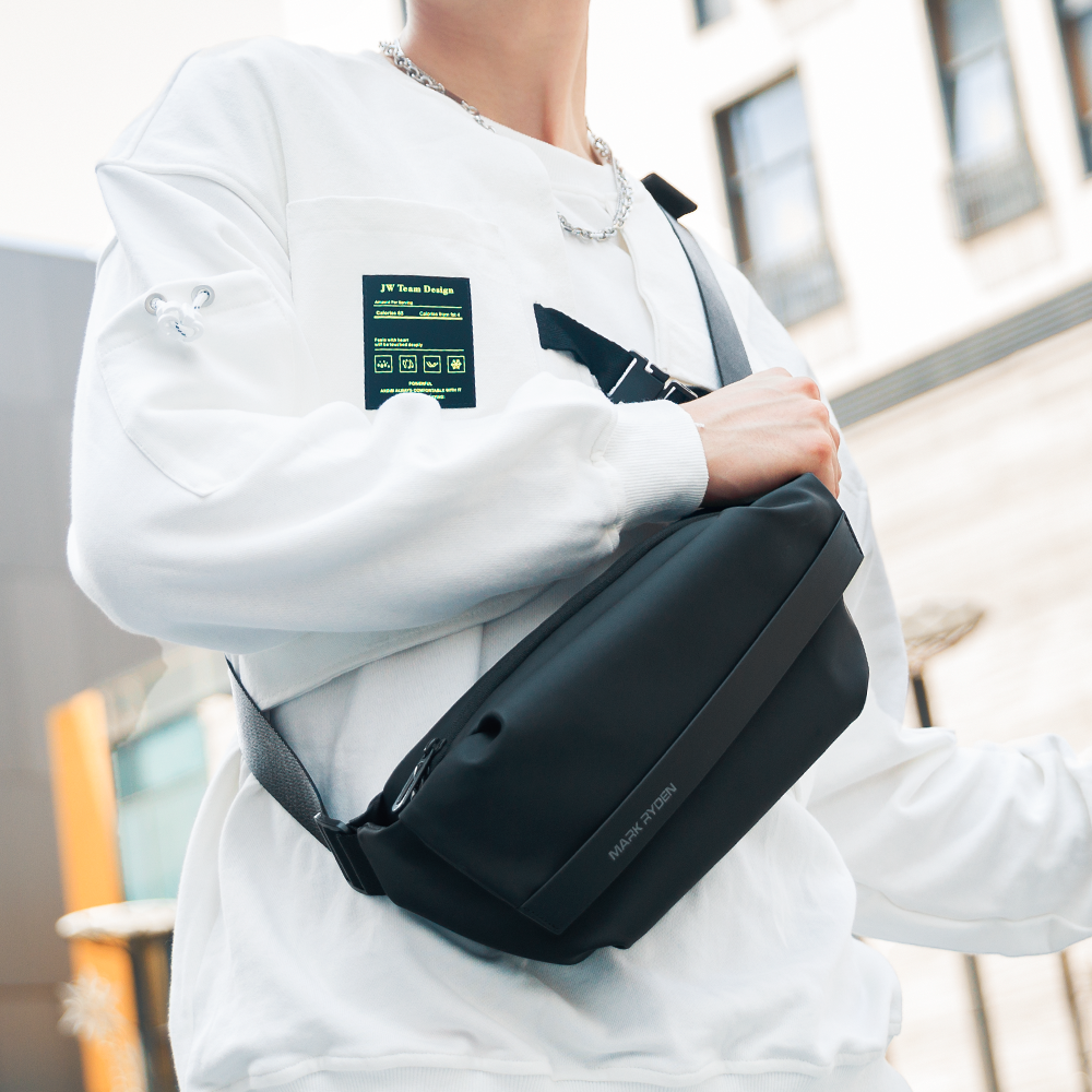 Mark Ryden black waterproof oxford crossbody bag, lightweight design, urban setting.