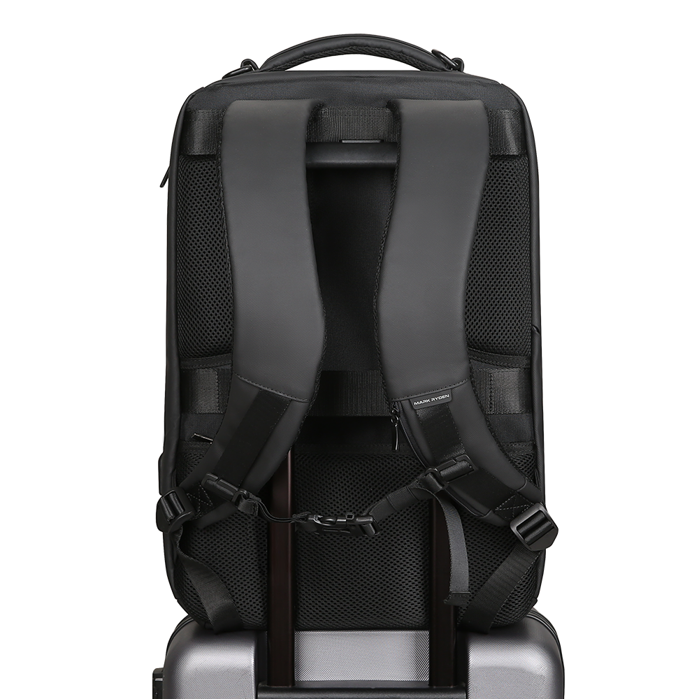 MarkRyden Compacto Pro backpack with padded straps, mesh panels, attached to luggage – futuristic daily travel bag