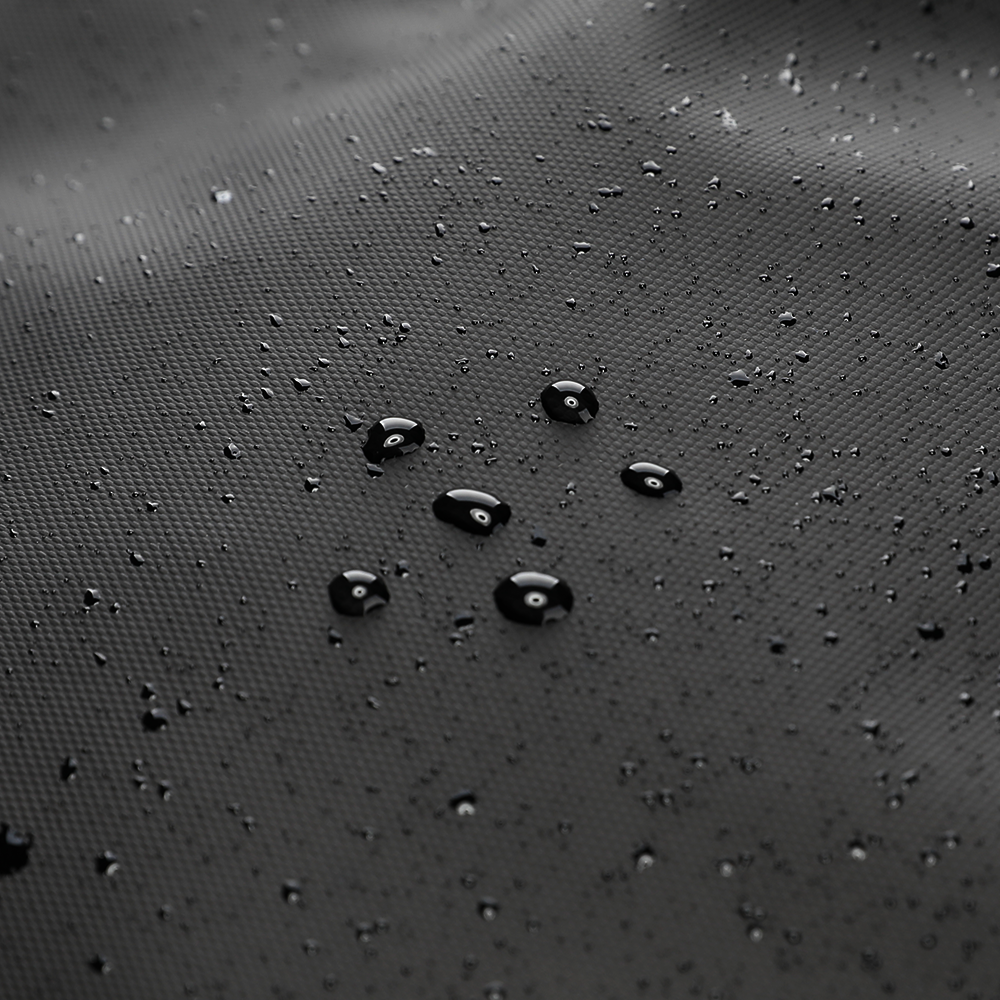 Close-up of water-repellent fabric with beading droplets on MarkRyden's multifunctional backpack, showcasing its durable, weather-resistant material for modern travels.