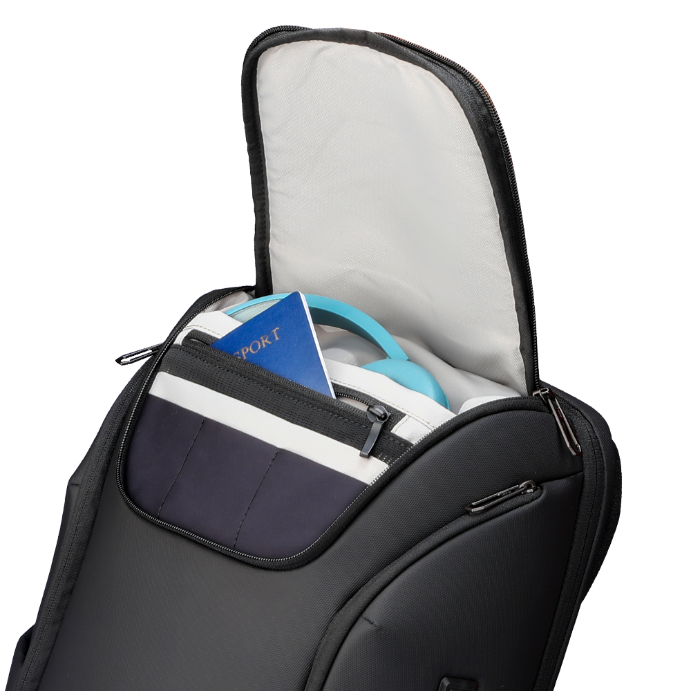 Black waterproof travel backpack with built-in USB, open to reveal a blue passport and light blue headphones in its spacious interior.