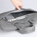 Gray Mark Ryden business laptop bag holding Apple device, 13.3-15.6 inch