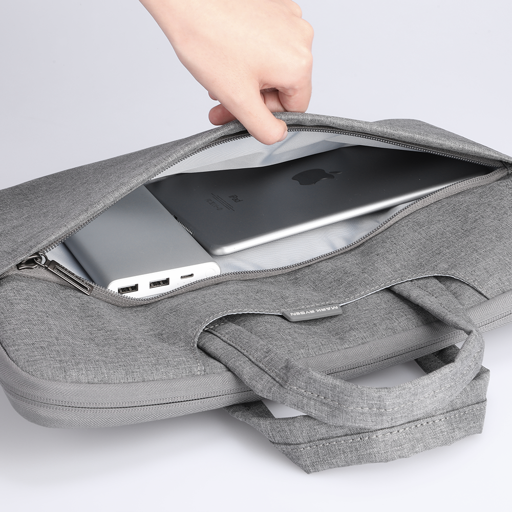 Gray Mark Ryden business laptop bag holding Apple device, 13.3-15.6 inch
