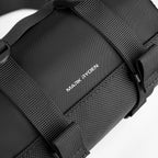 Mark Ryden black cylinder crossbody bag with straps